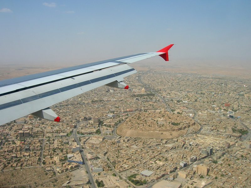 View from airplane window over the ancient Erbil citadel and city below, Kurdistan Iraq