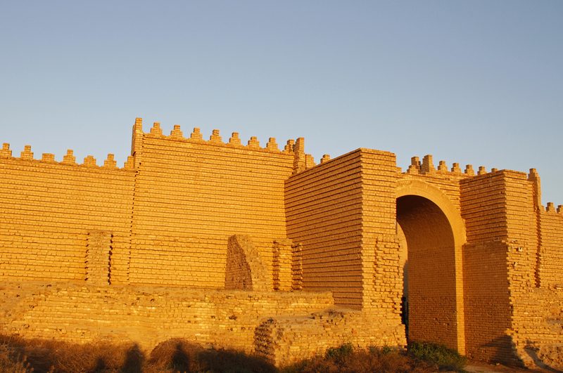 Reconstructed ancient mud brick walls of Babylon at golden hour, Iraq