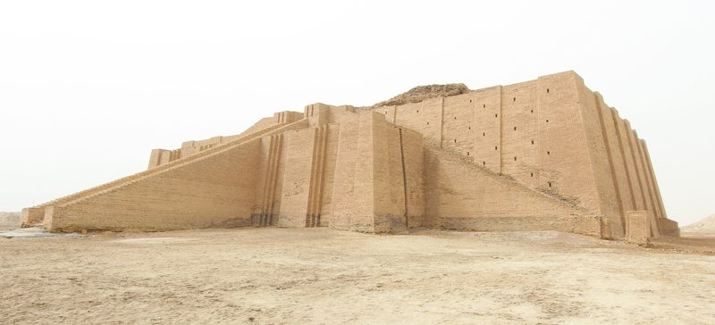 The Great Ziggurat of Ur rising from the flat desert plain in southern Iraq