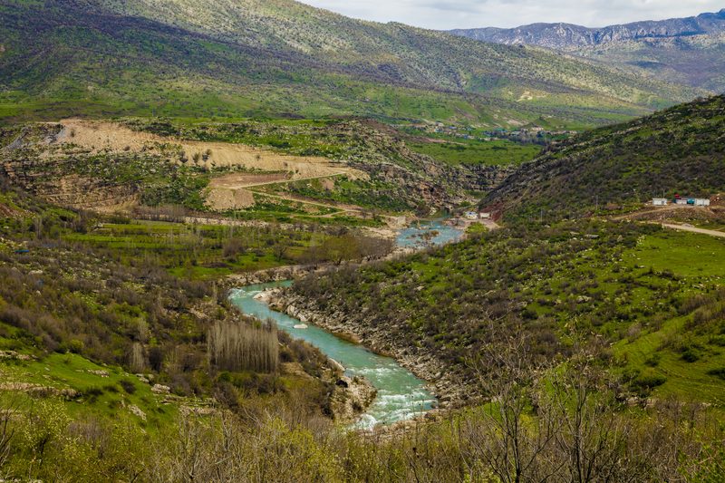 Lush green river valley winding through the mountains of Kurdistan, northern Iraq