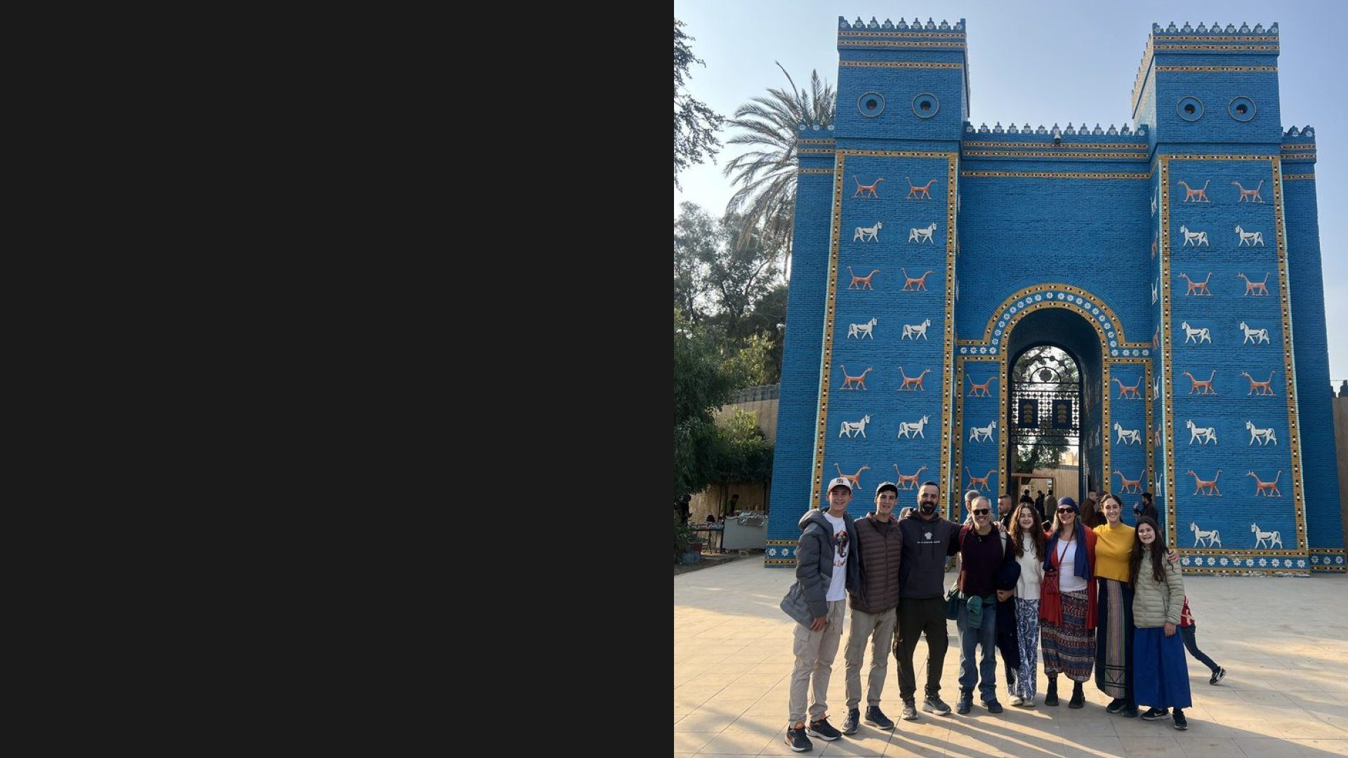 Ali Babylon Tours group photo at the Ishtar Gate replica in Babylon Iraq