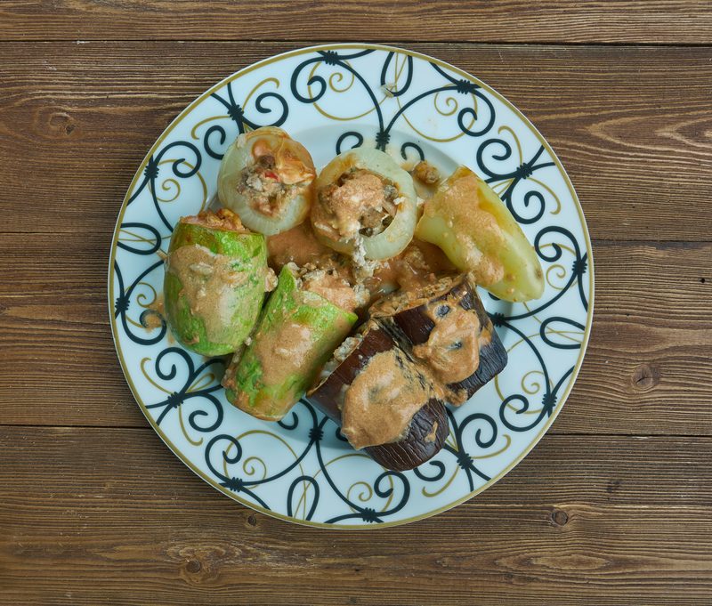 Traditional Iraqi dolma with stuffed zucchini, eggplant and peppers served on a decorative plate