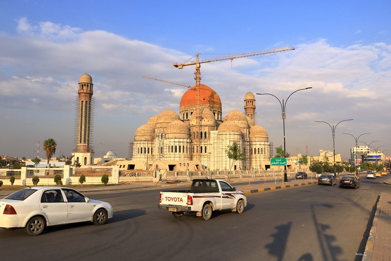 The Mosul Grand Mosque with multiple domes under construction with cranes, Iraq