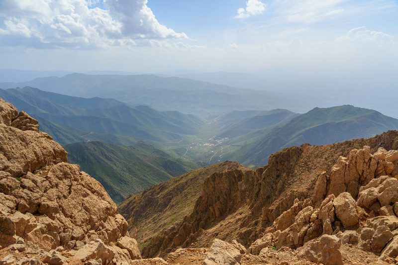 Panoramic view from a mountain peak over a green valley in Kurdistan, northern Iraq