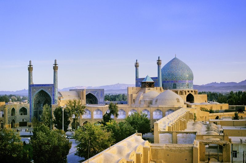 Aerial view of the Shah Mosque in Isfahan Iran with its iconic blue tiled dome and minarets overlooking Naqsh-e Jahan Square