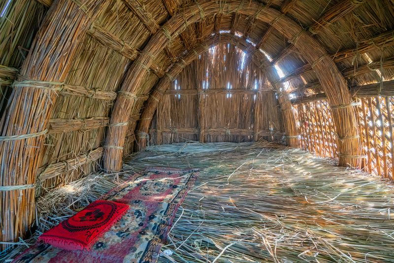 Interior of a traditional reed mudhif guesthouse with arched ceiling in the Mesopotamian marshes, Iraq