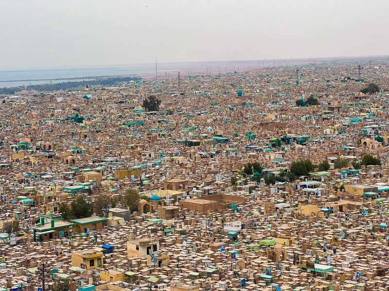 Aerial panorama of Wadi al-Salam (Valley of Peace), the world's largest cemetery, stretching to the horizon in Najaf, Iraq